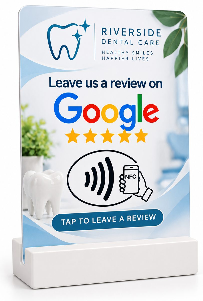 White countertop stand holding a Riverside Dental Care Leave us a review on Google tap card